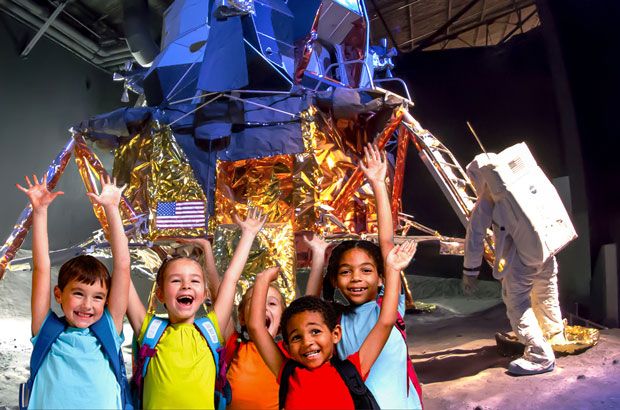 Children beside the lunar module exhibit at the Cradle of Aviation Museum; venue photo