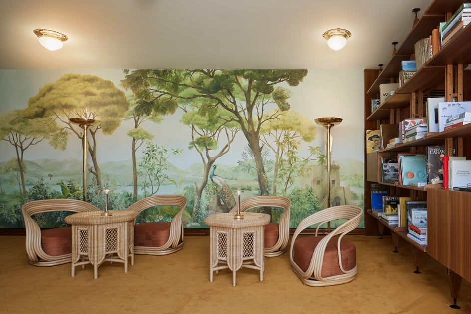 Garden mural and wicker chairs at Bvlgari Hotel Roma