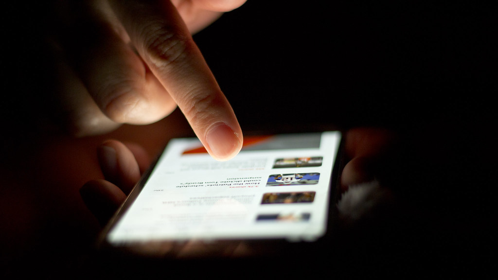 A person scrolling on a phone