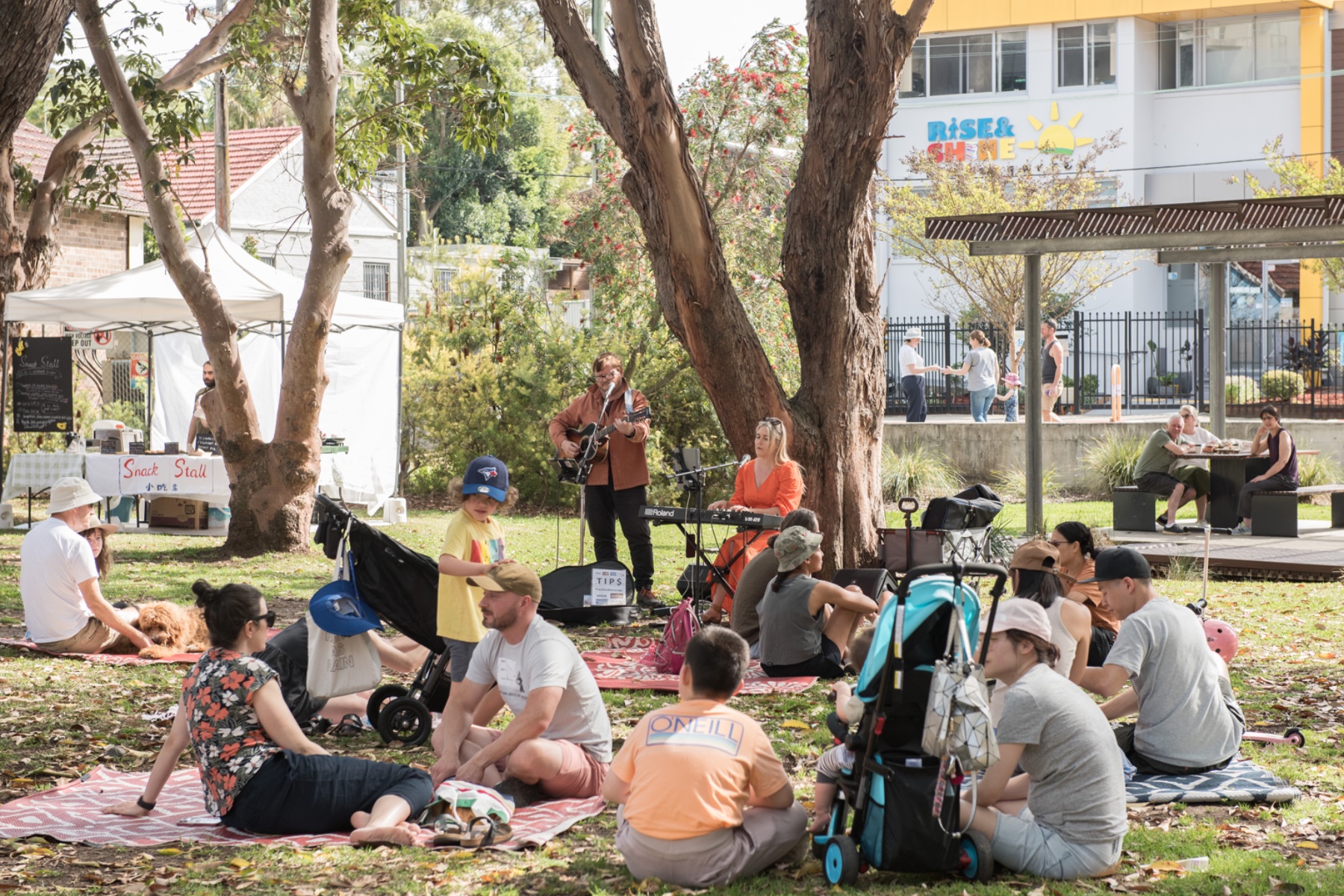People enjoying live music and markets at Flour Mill Markets