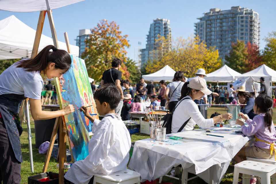 Families making art at outdoor workshops during Art Fest Canada in Richmond BC