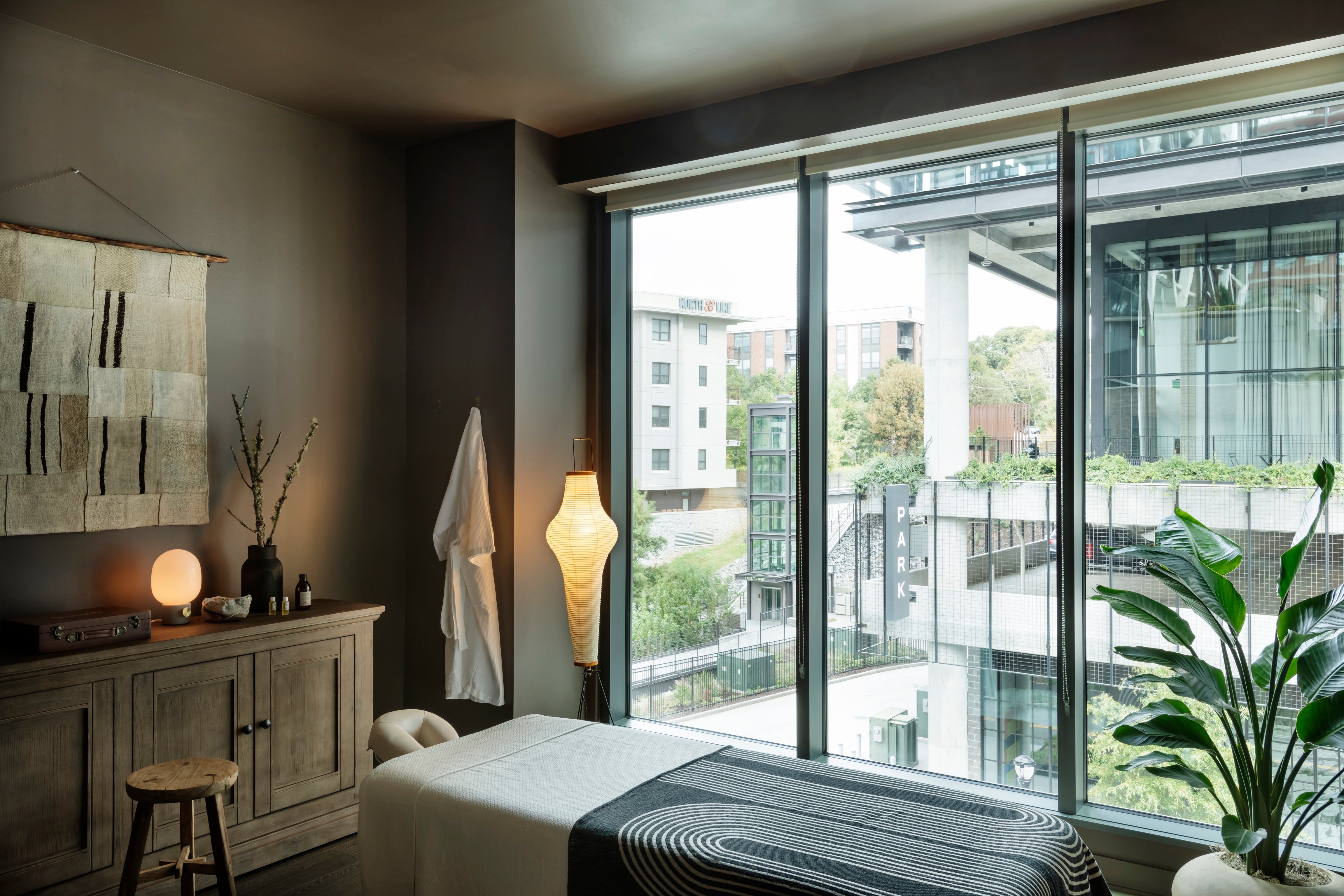 Massage treatment room overlooking the city at Forth Atlanta