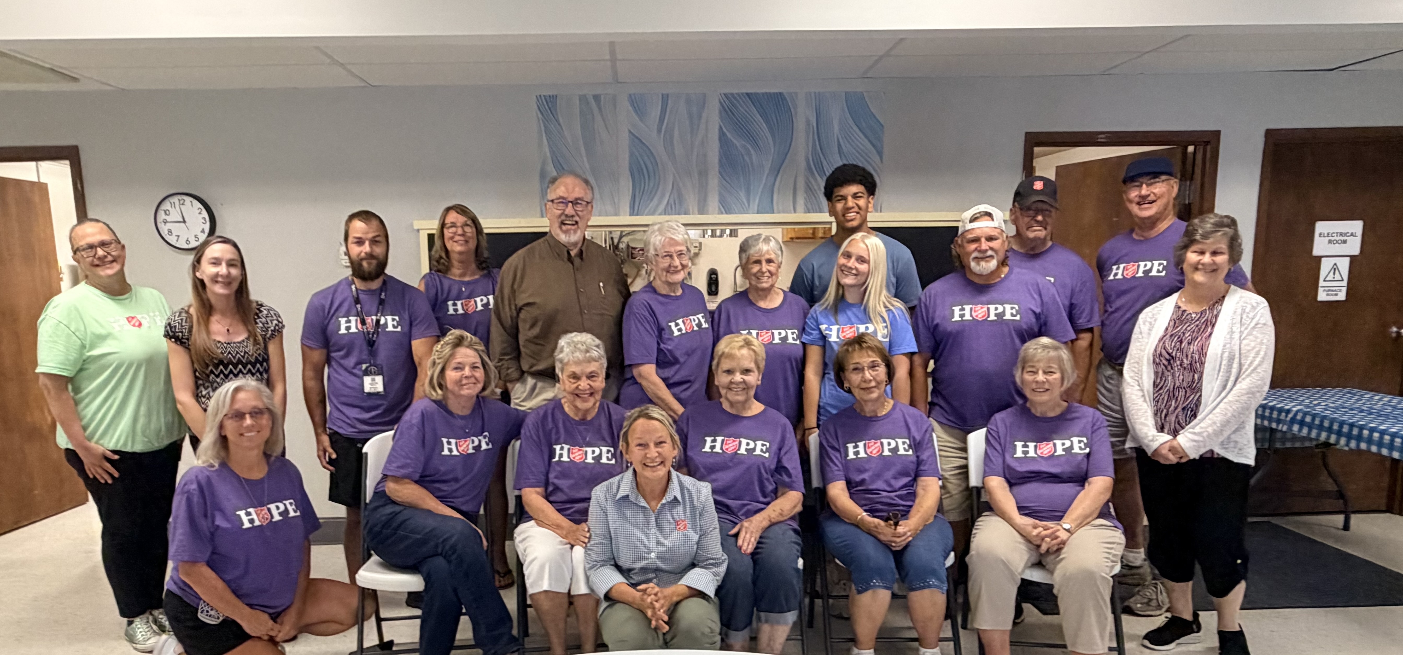 Volunteers with Danette Davidson, staff, and Larry Hostetler