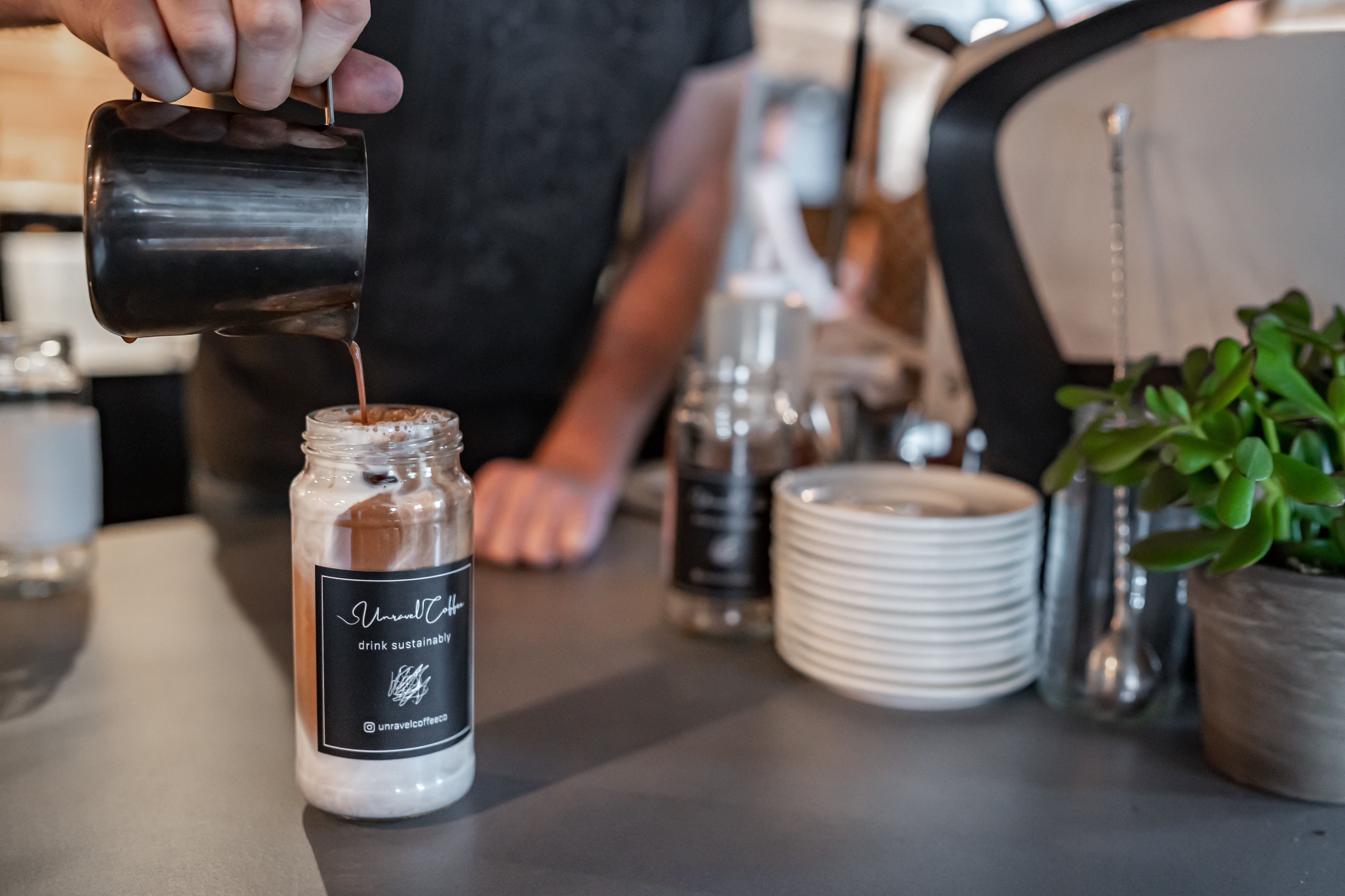 Coffee being poured at Gravity Haus Breckenridge