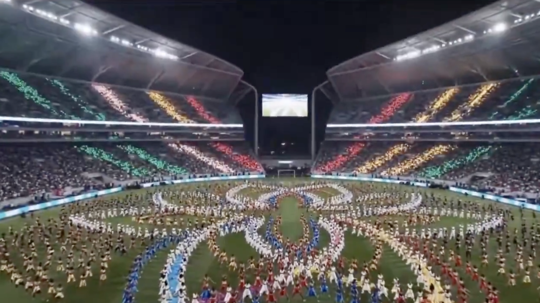 Shakira performing on a nighttime stage surrounded by fireworks, a scene that doesn't match any real World Cup opening ceremony