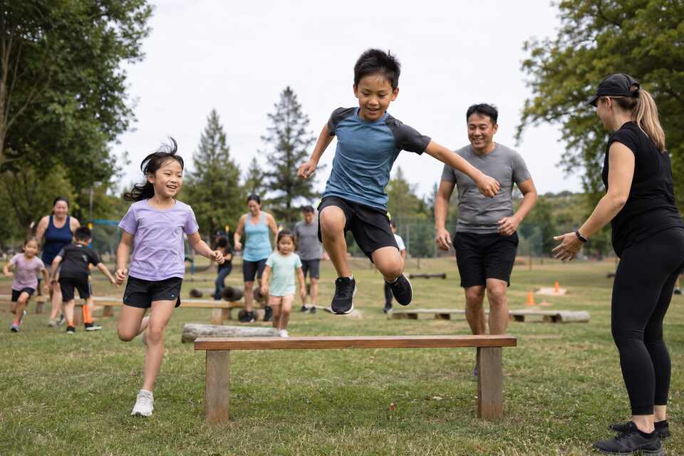 Children and parents completing a fun outdoor obstacle challenge in Richmond BC