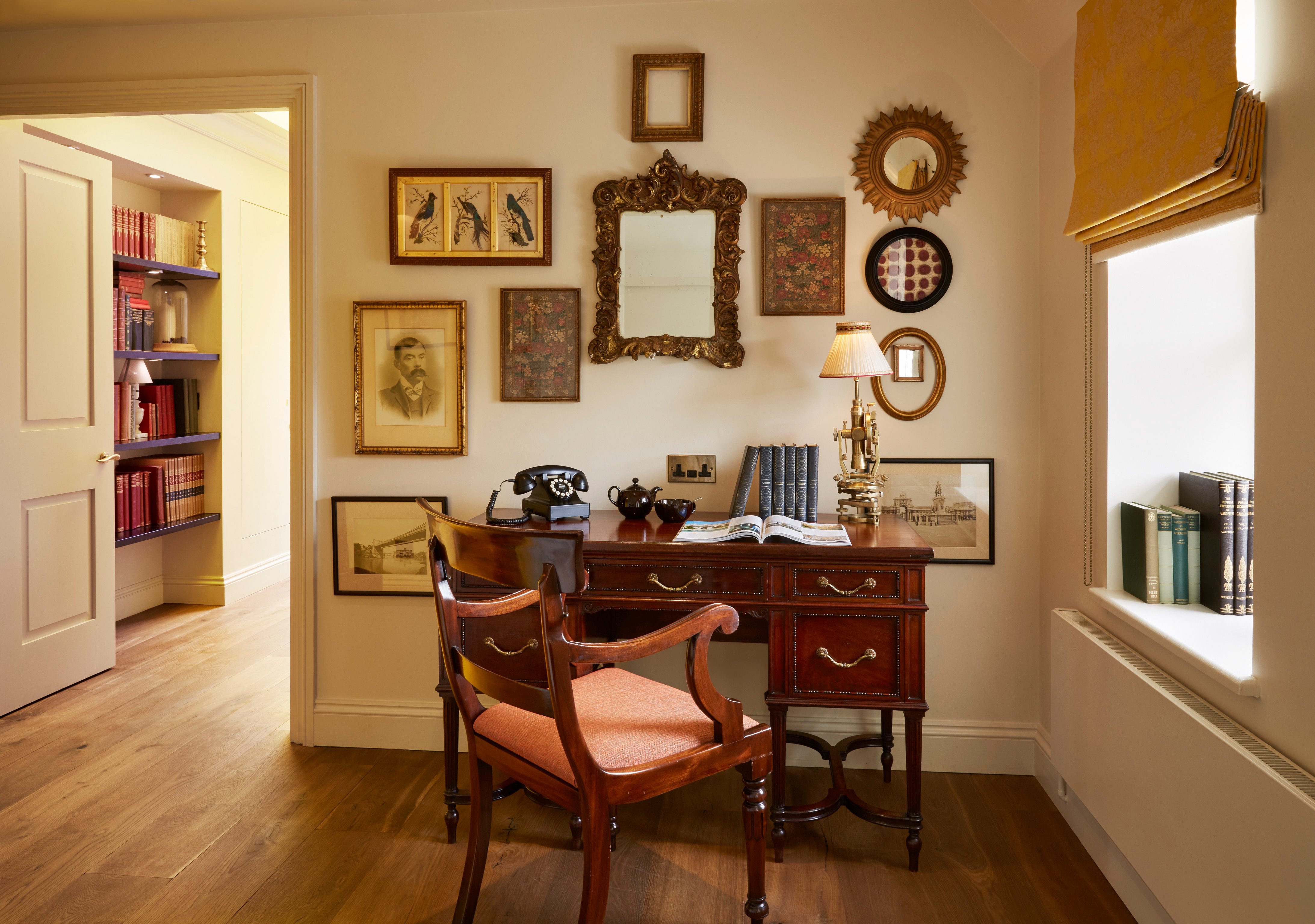 Antique desk and gallery wall at The Zetter Marylebone