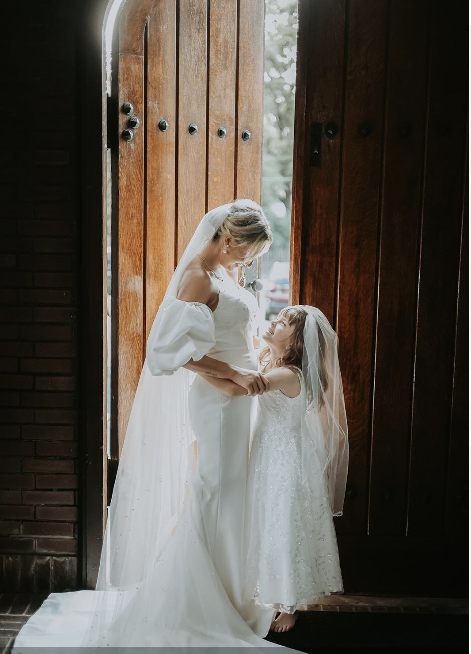 Bride and child moment captured by Wild A.T Photography