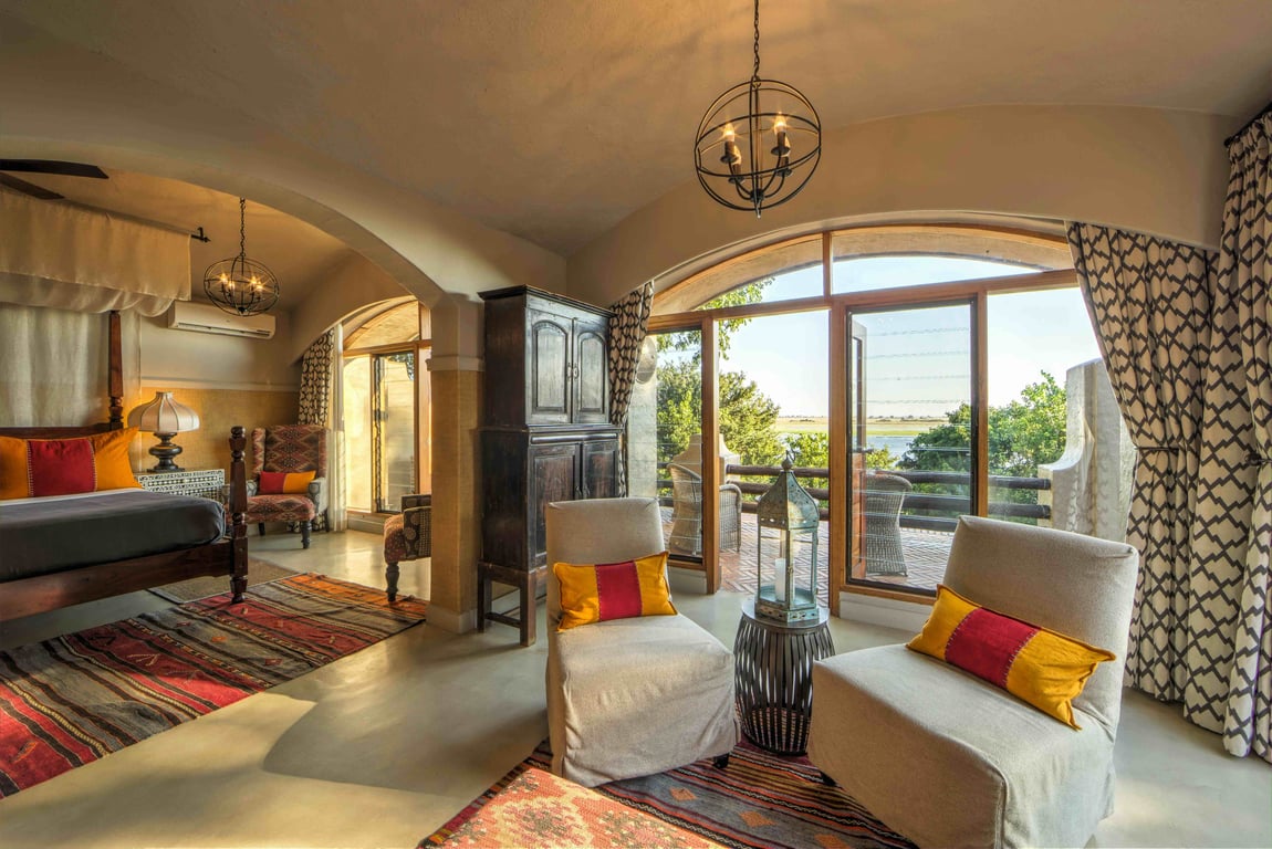 Guest suite with a private seating area at Chobe Game Lodge