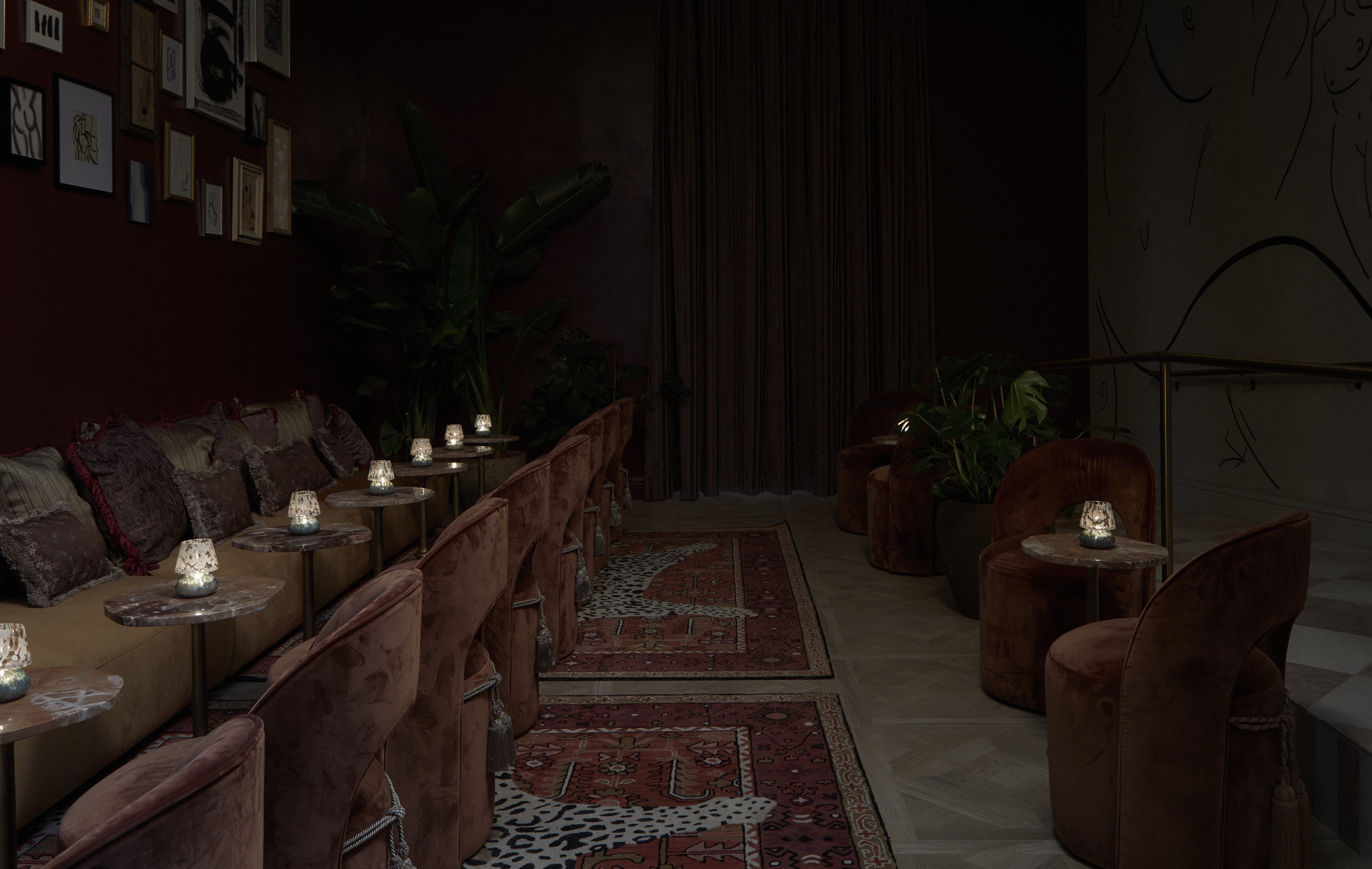 Low-lit guest lounge with velvet seating at Granger Hotel