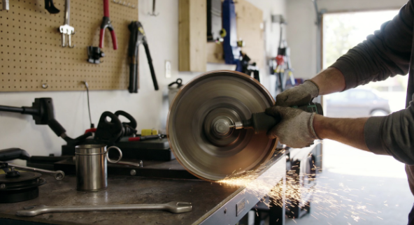 A simple garage setup for sharpening a lawn mower blade safely