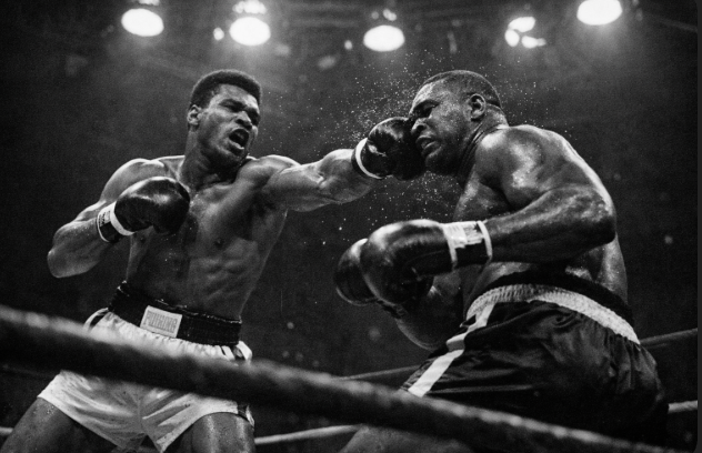Cassius Clay (later Muhammad Ali) lands a right hand on heavyweight champion Sonny Liston during their February 25, 1964 title fight
