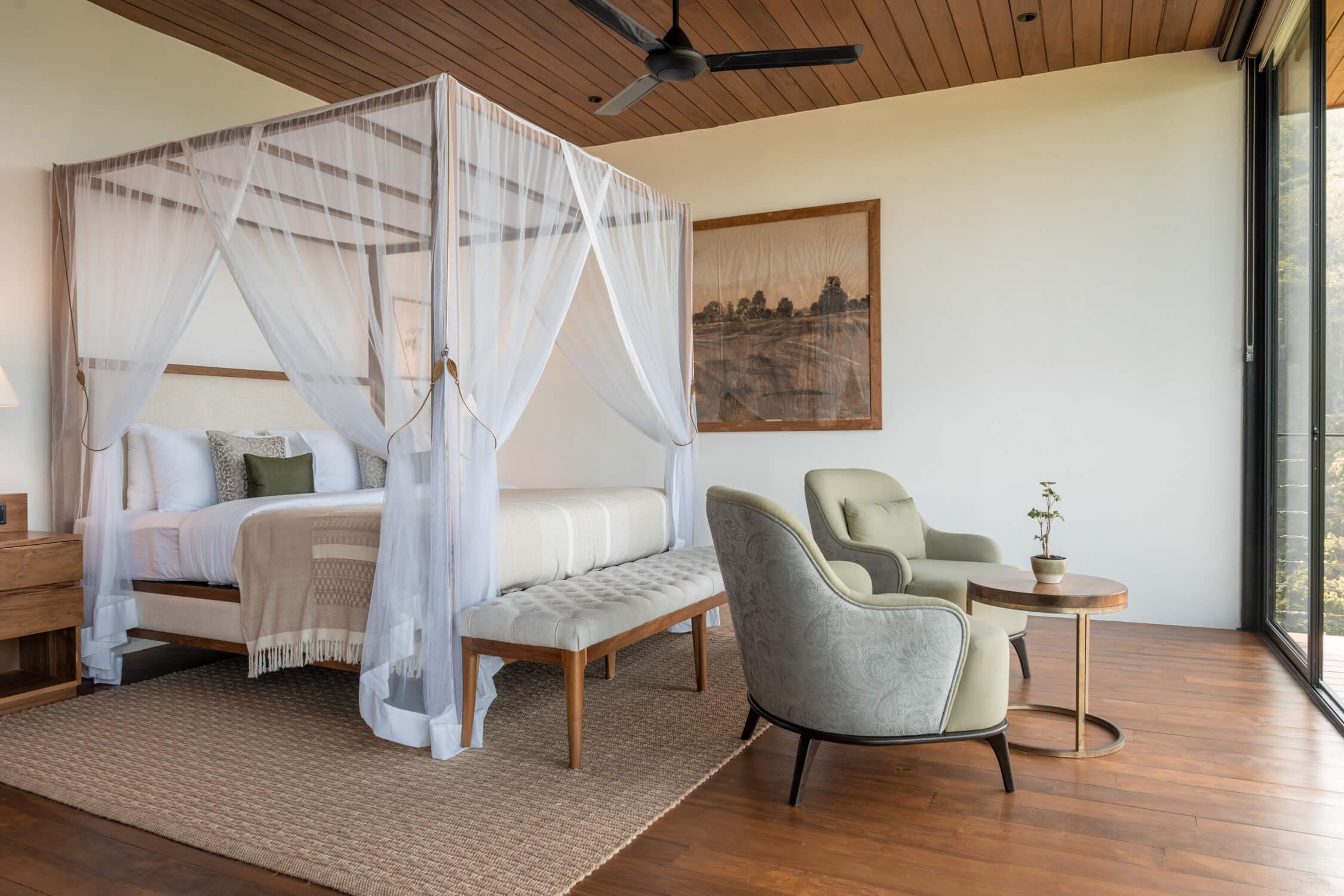 Four-poster bed and seating in a Glenross Living villa