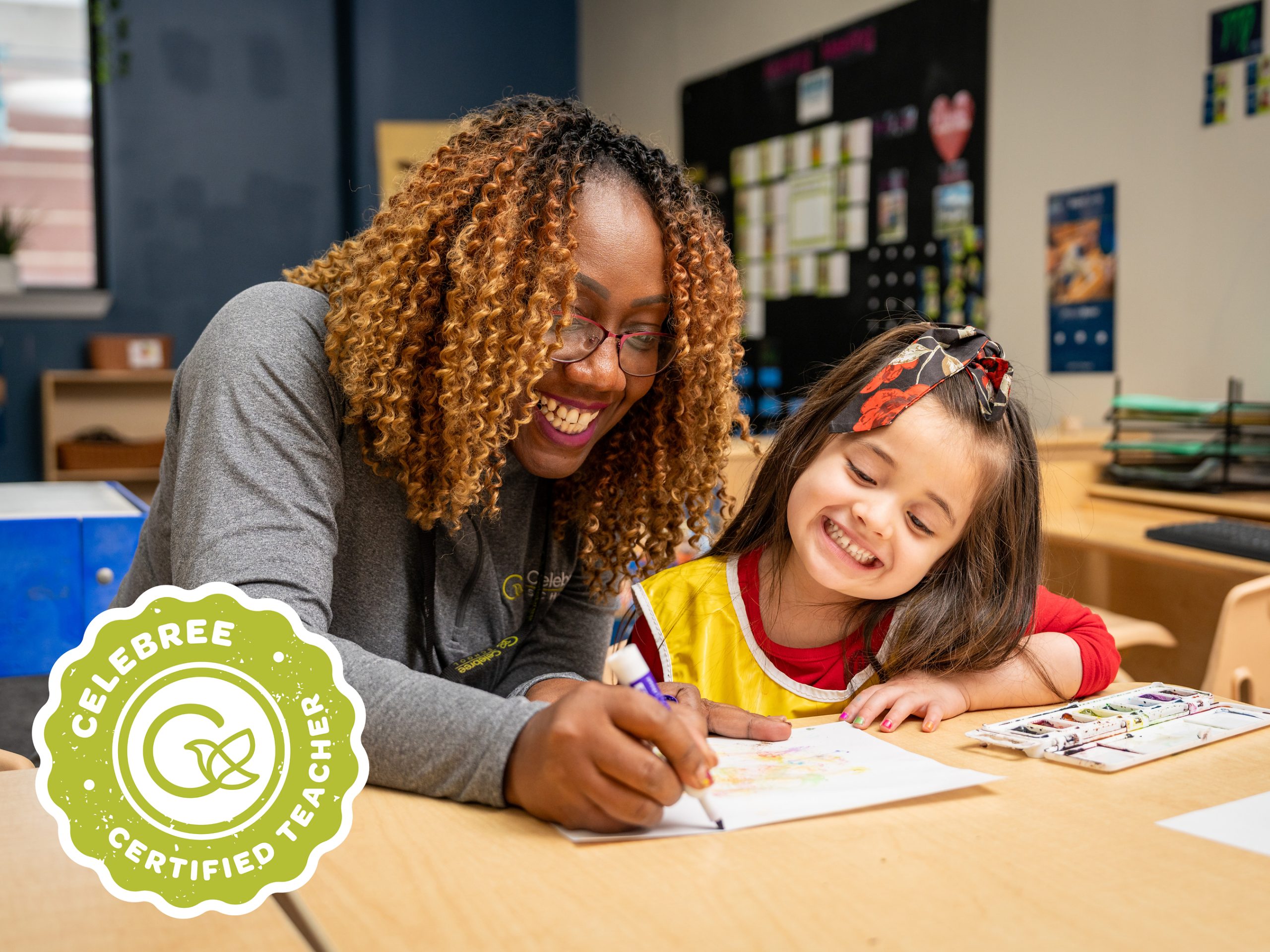A Celebree School teacher helps a child with an art activity. Courtesy of Celebree School.