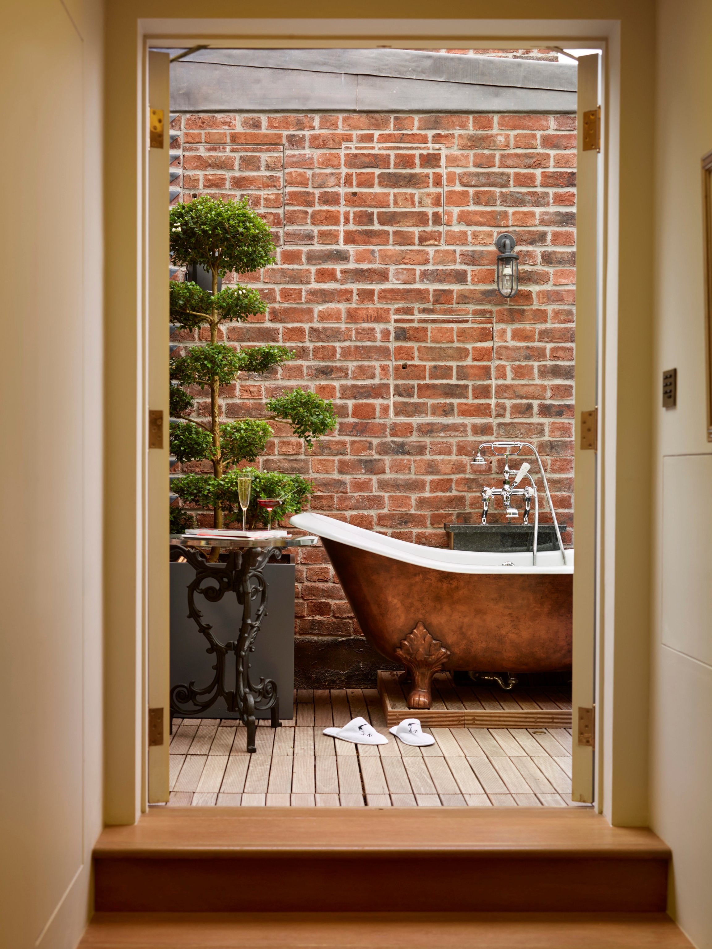 Outdoor copper bathtub on a private terrace at The Zetter Marylebone