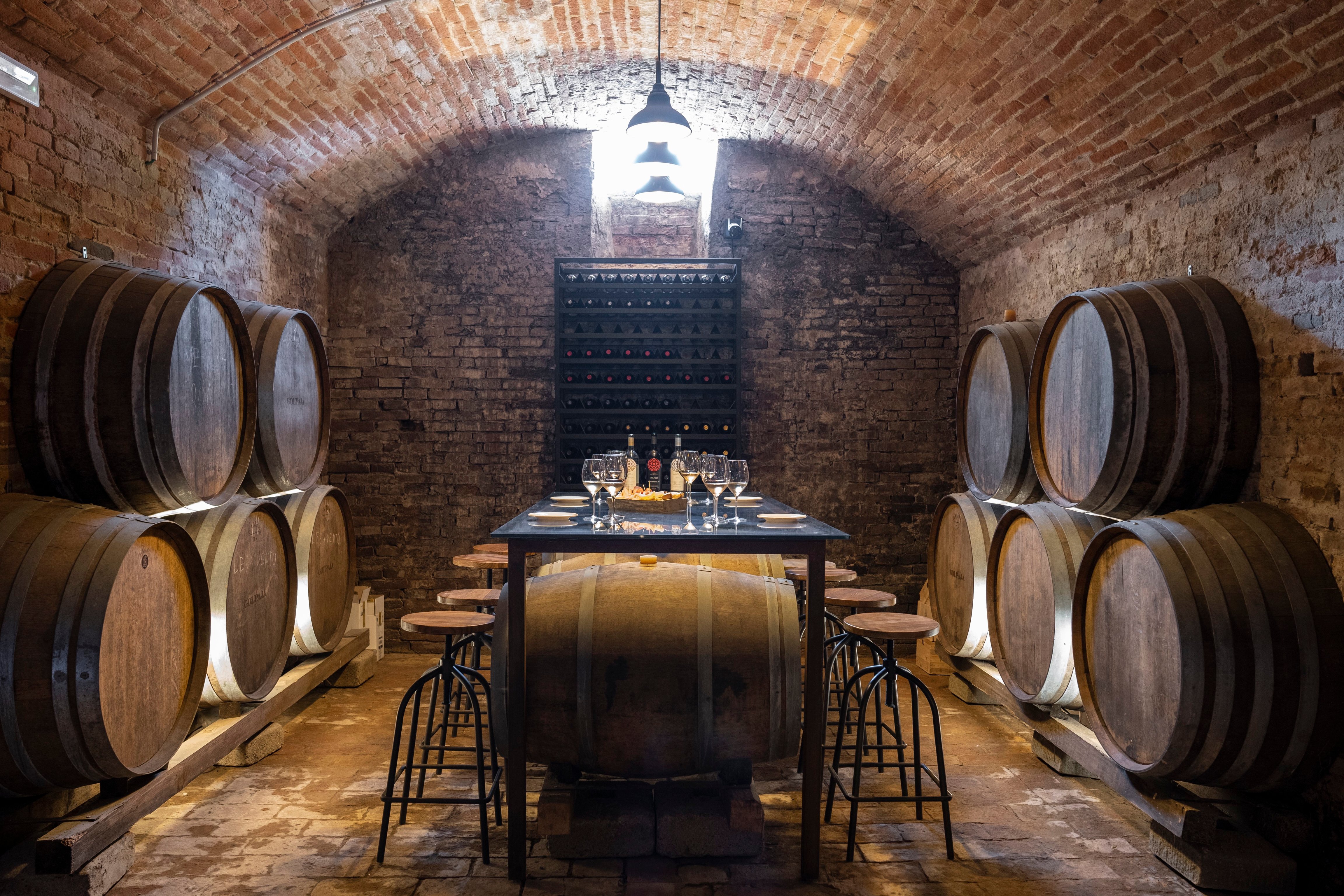 Wine barrels and tasting table at Villa Petriolo