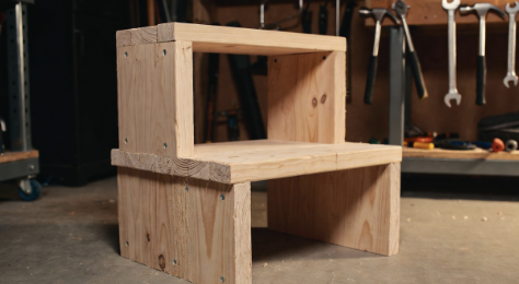 Wooden step stool in a garage workshop setting