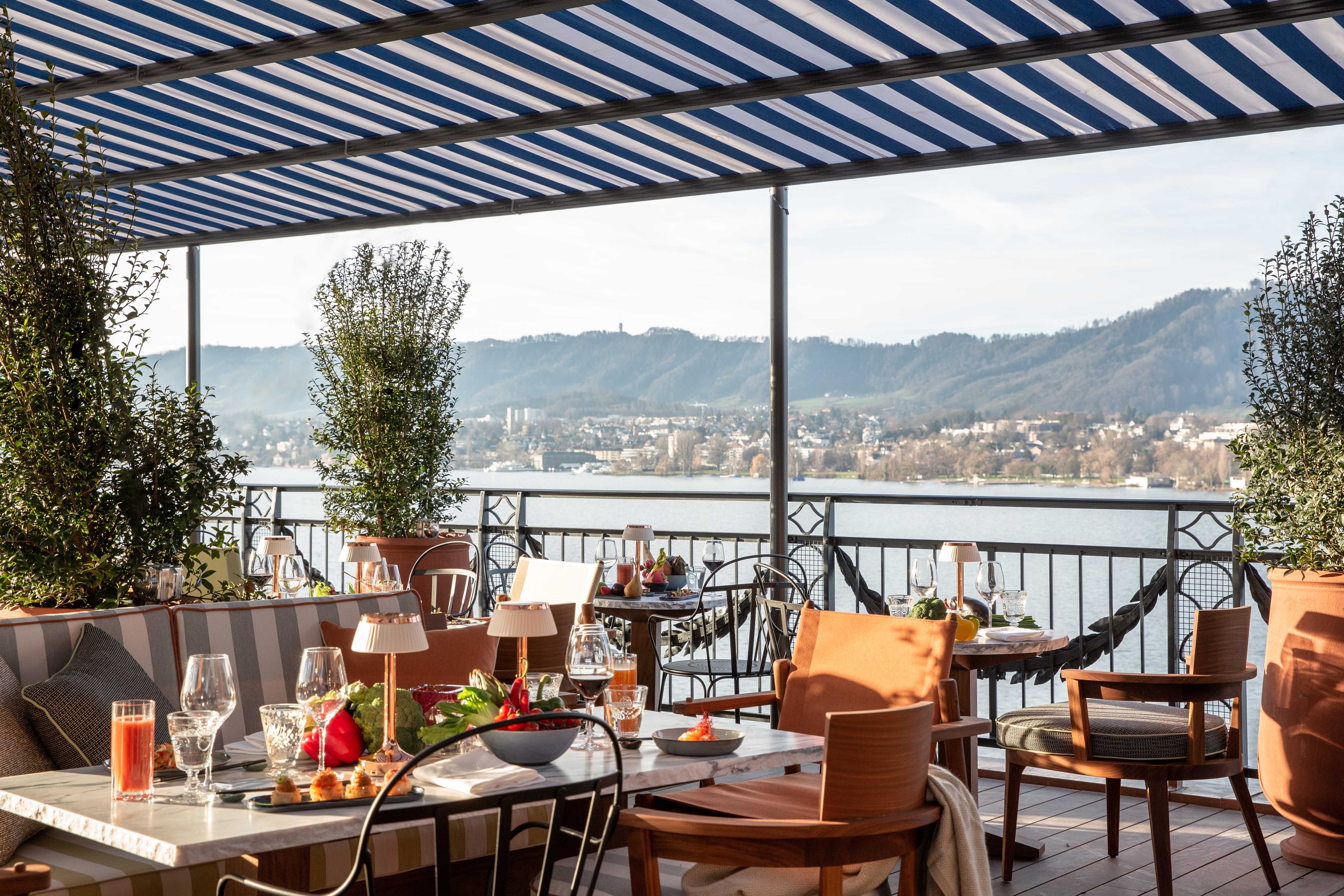 Lake-facing restaurant terrace at La Réserve Eden au Lac
