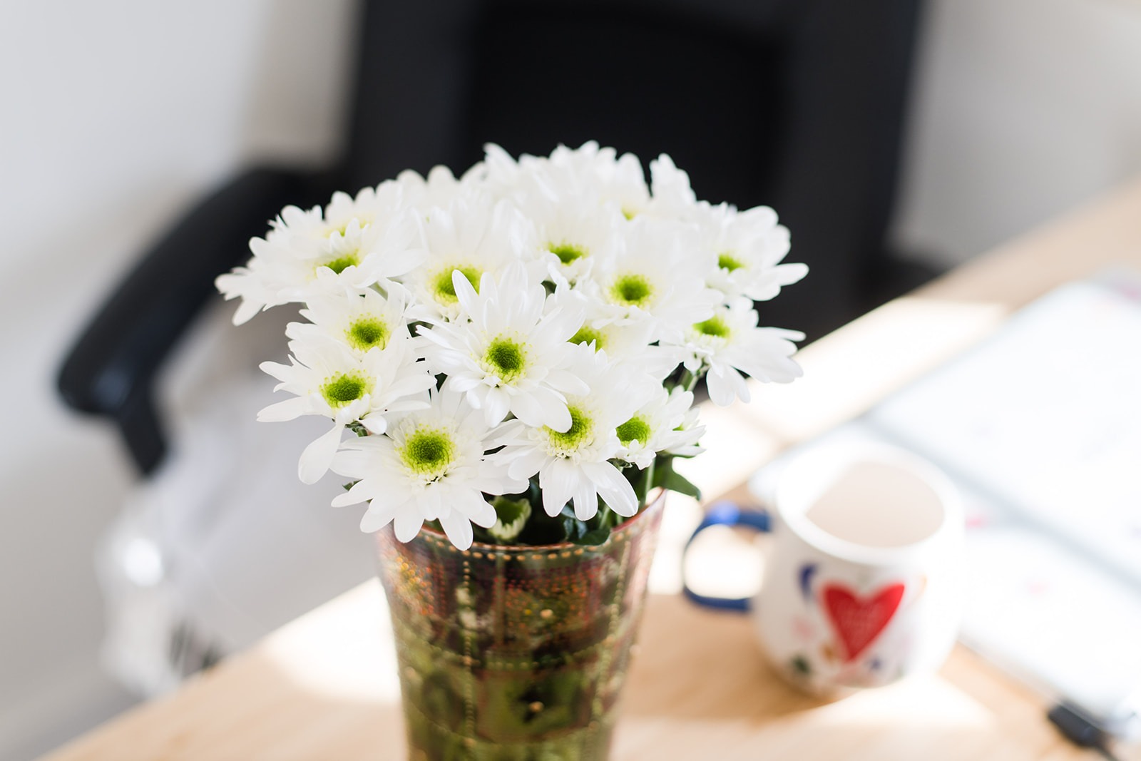 A bunch of white daisies in soft morning light