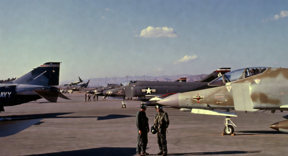 Vintage Navy fighter jets on a California airfield in the late 1960s