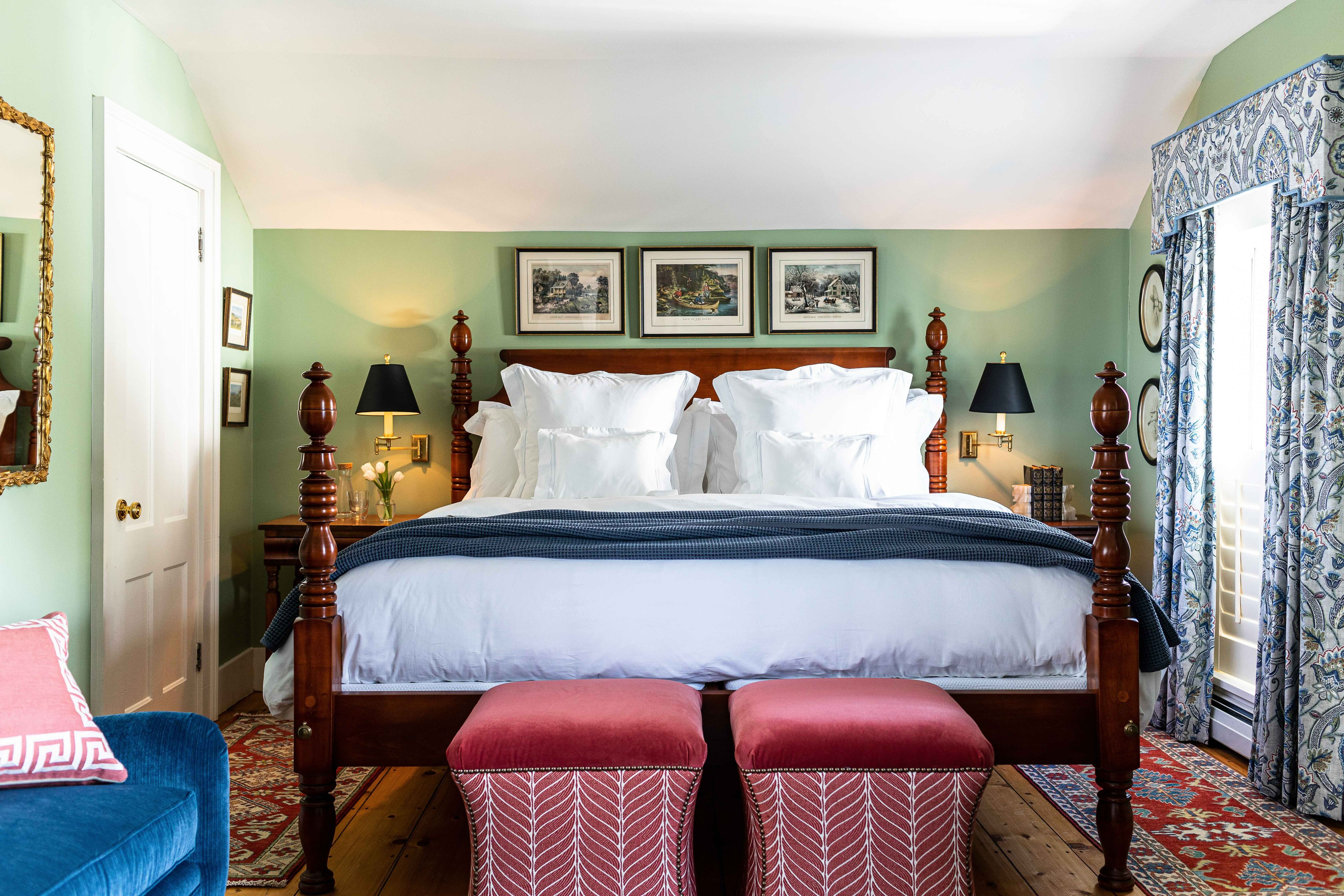 The Weston bedroom with a four-poster bed and patterned curtains