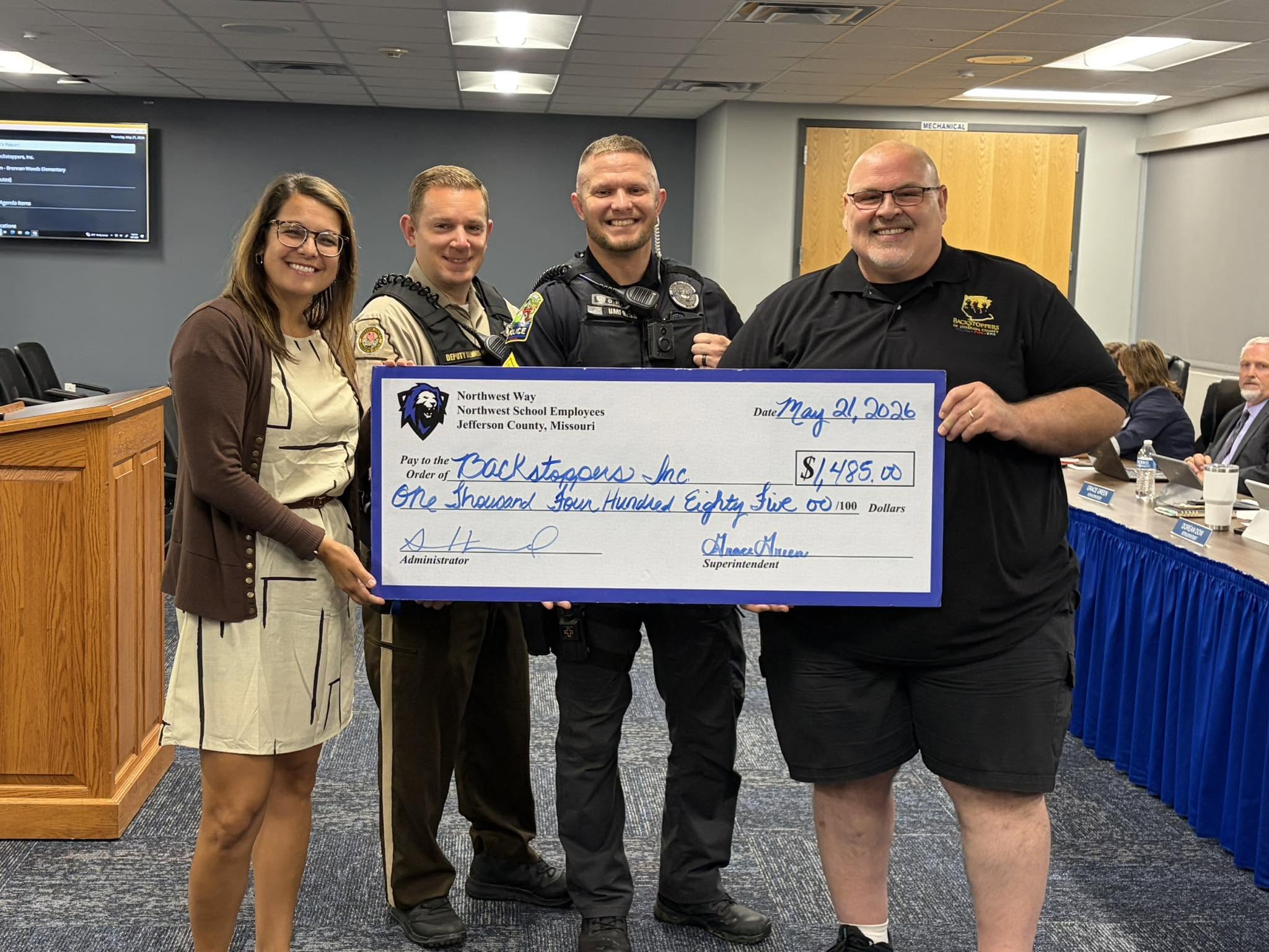 Donation check presented in support of BackStoppers