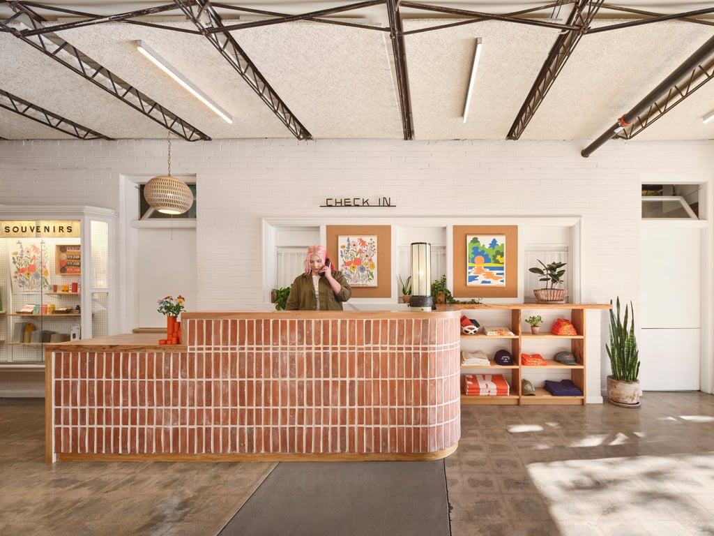 Brick-front reception desk in Carpenter Hotel’s former union hall