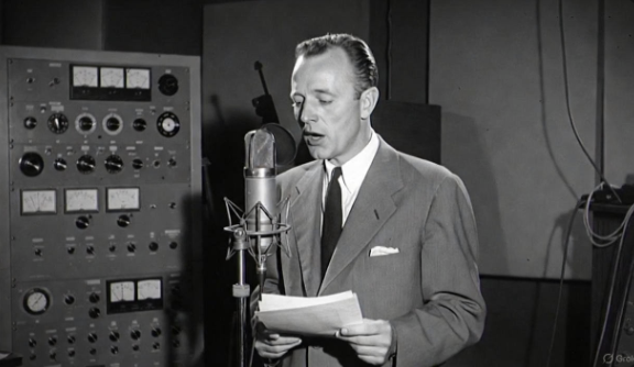 Bing Crosby performing at a radio microphone in the 1940s