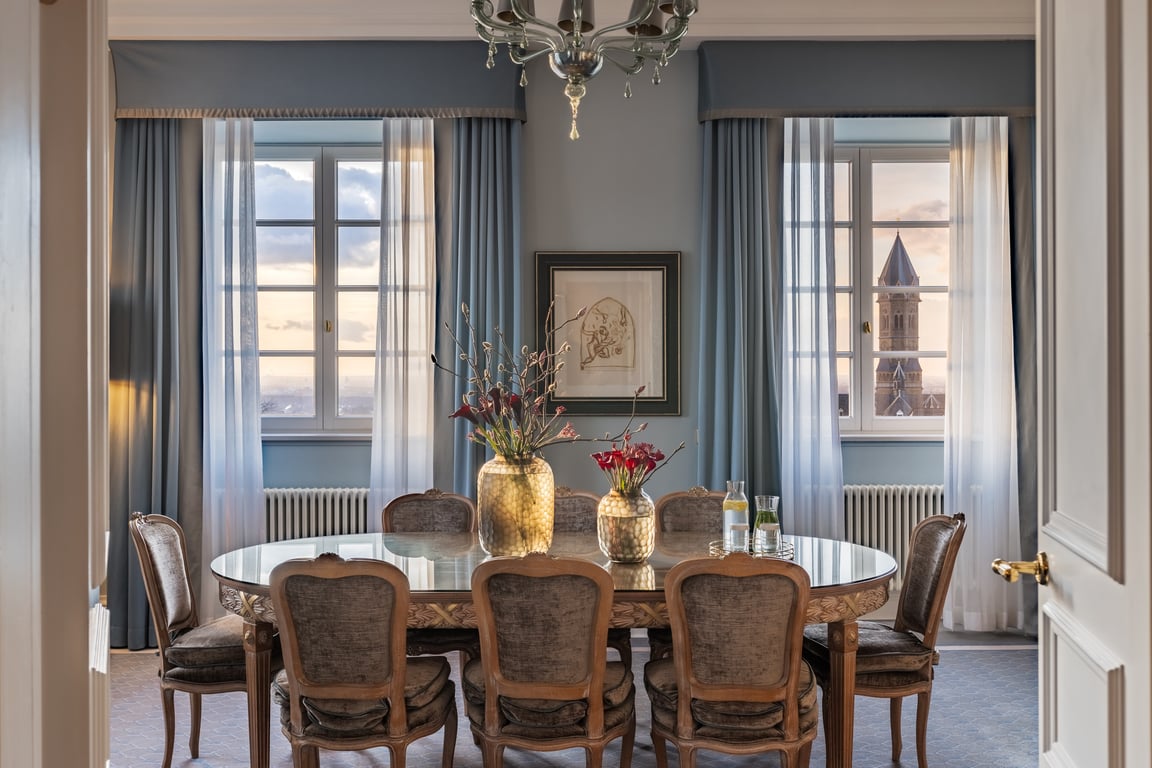 Elegant dining and sitting room at Althoff Grandhotel Schloss Bensberg