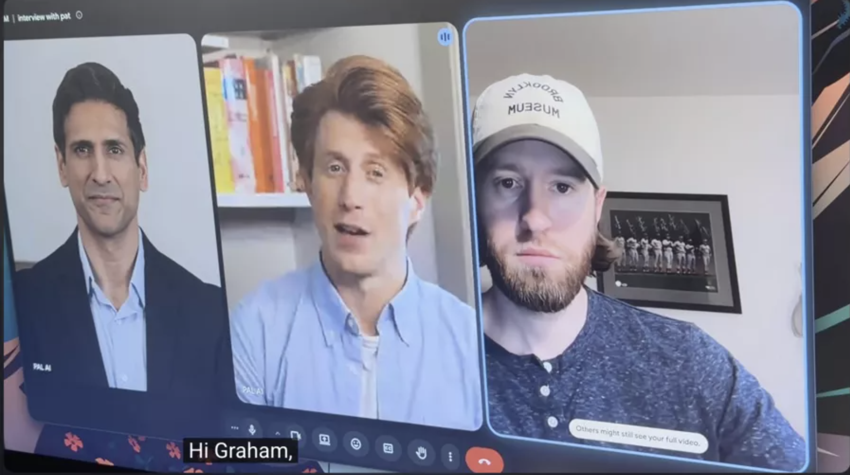 A man watching a video call in which an AI recruiter and his own AI assistant discuss his career, a still from a comedy video that spread as if it were a real job interview