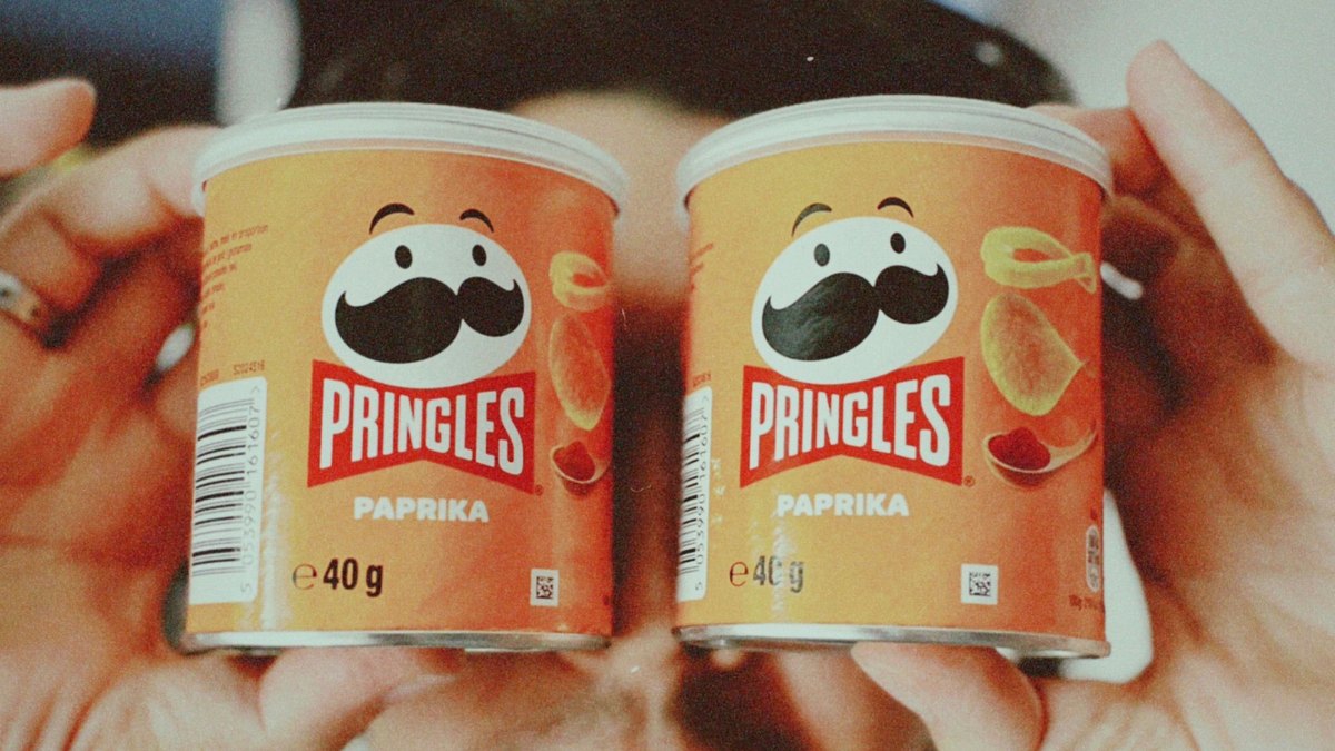 Close-up of the Pringles mascot on a tube