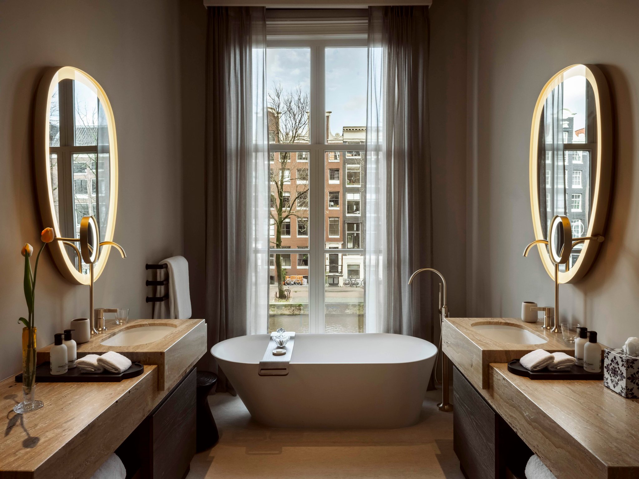 Guest bathroom with a freestanding bathtub beside a window