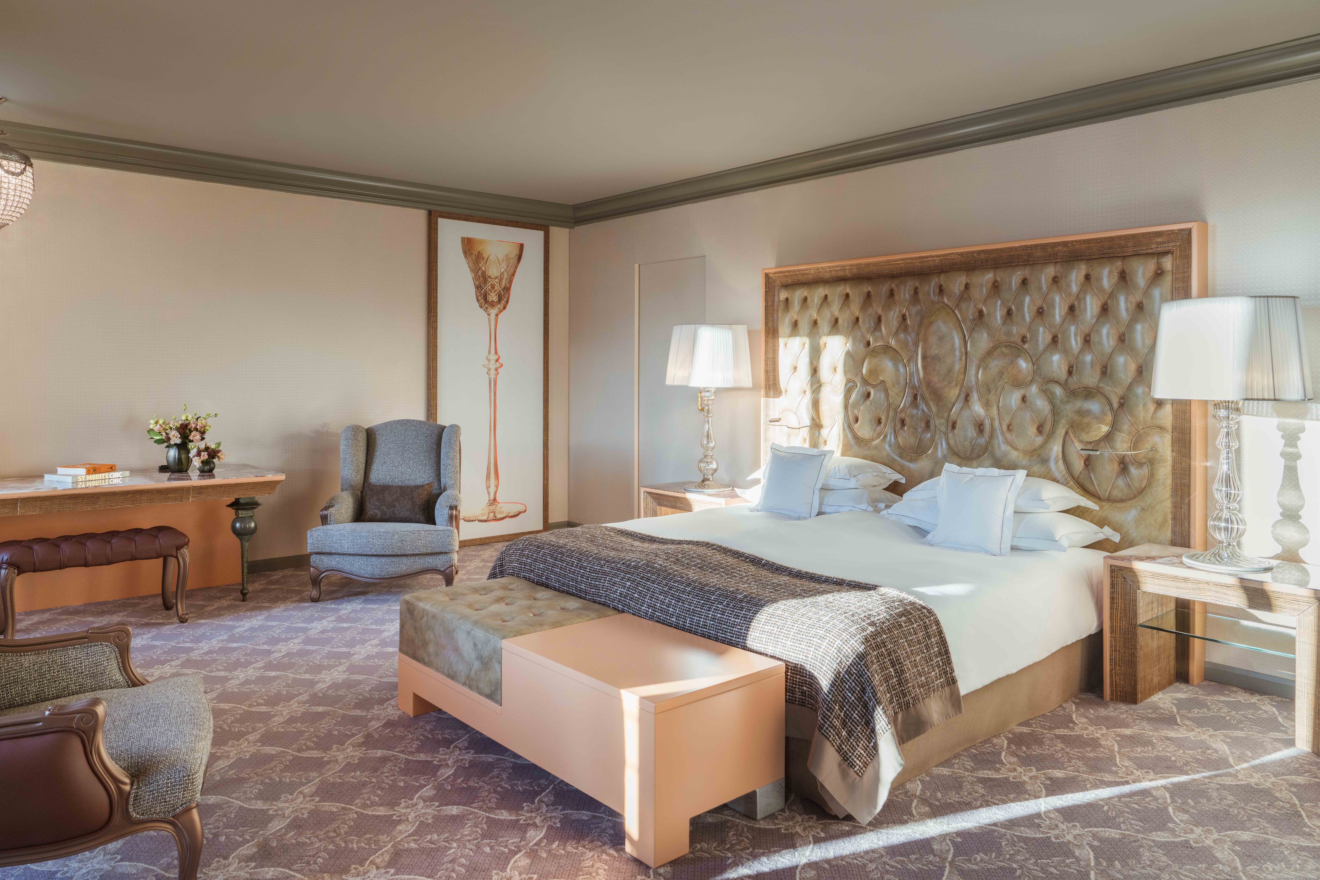 Spacious bedroom and sitting area at Carlton Hotel St. Moritz