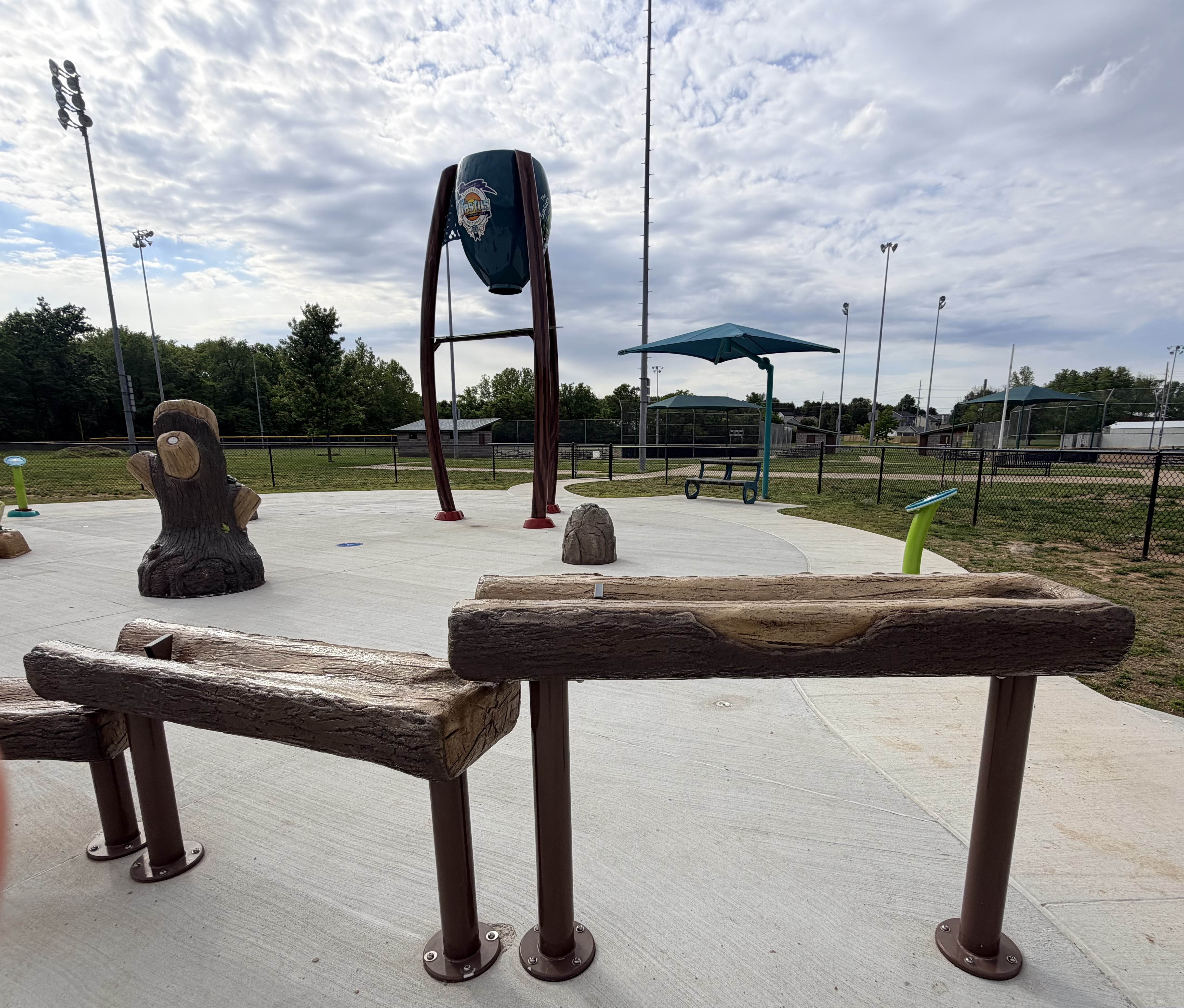 Log flume and dump bucket features at Turtle Cove splash pad in Festus