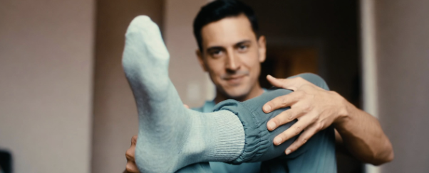 Close up of feet and ankles rotating while seated