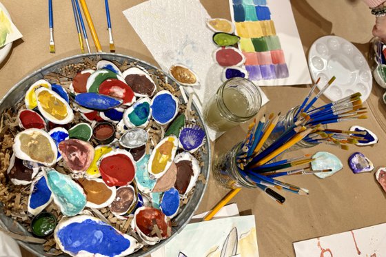 Painted oyster shells, brushes and palettes from the Color Field Study program image