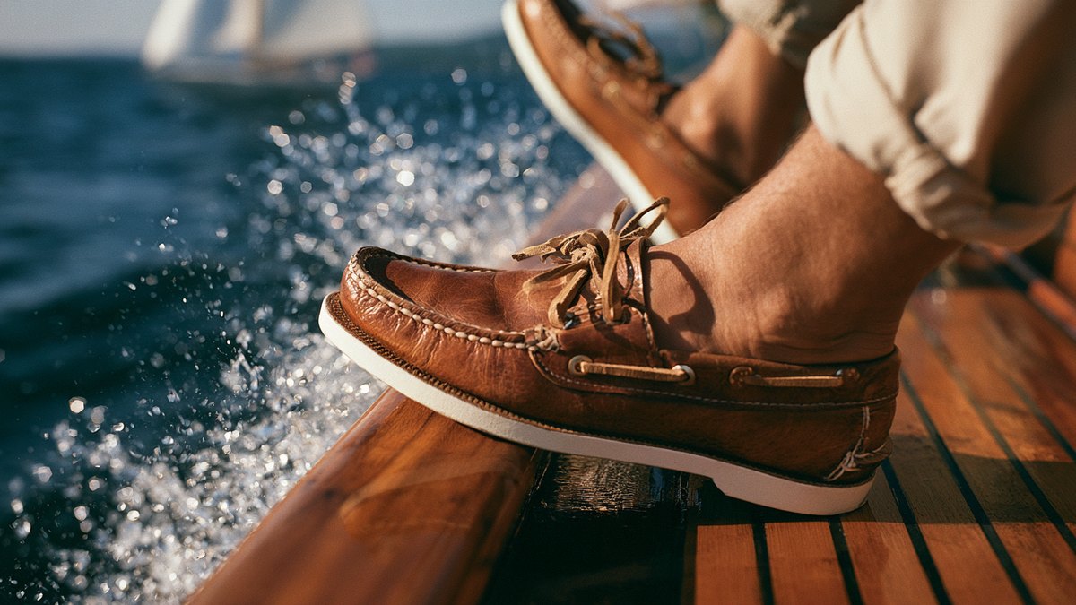 A pair of classic Sperry boat shoes on a wooden dock