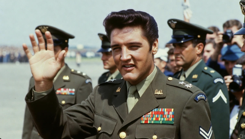 Elvis Presley waving to fans after returning from military service