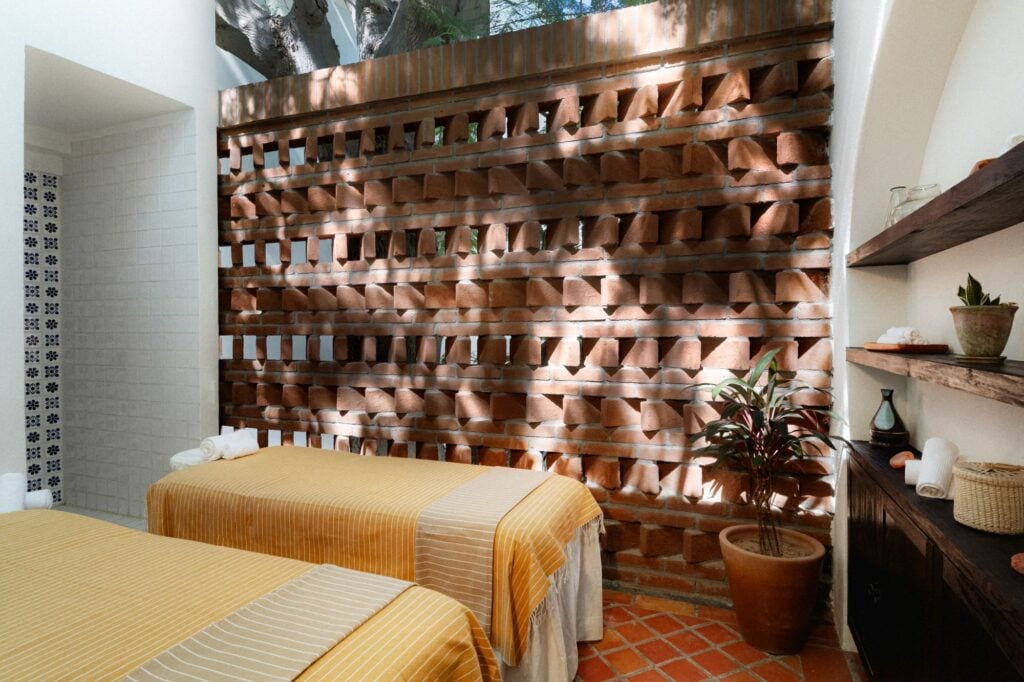 Spa treatment beds and terracotta wall details at Tropicana Los Cabos