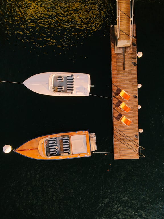 Private boats moored at Villa Làrio's Lake Como pontoon