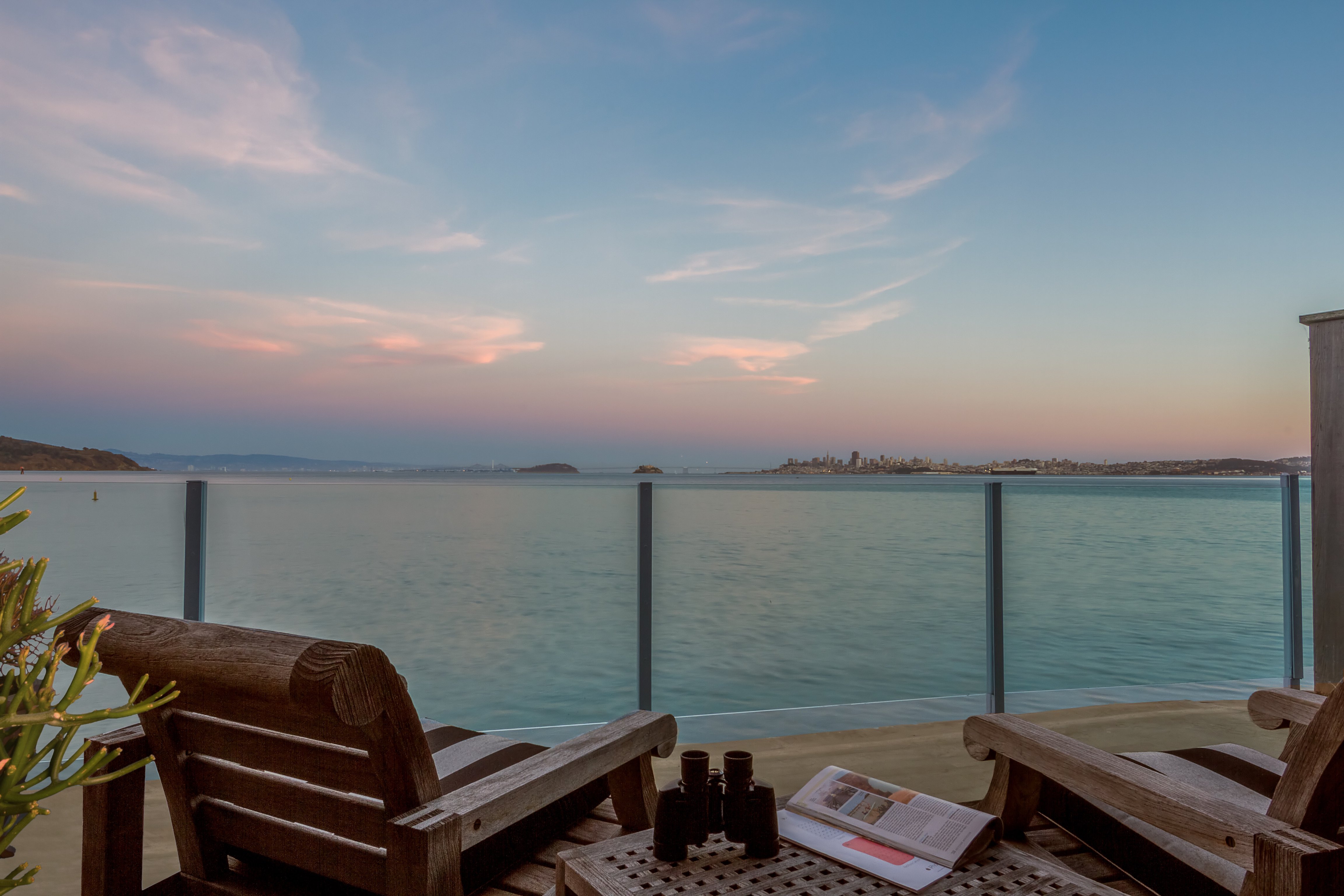 Private waterfront terrace at The Inn Above Tide in evening light