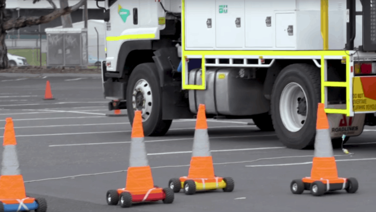 Robotic traffic cones deployed on a roadway