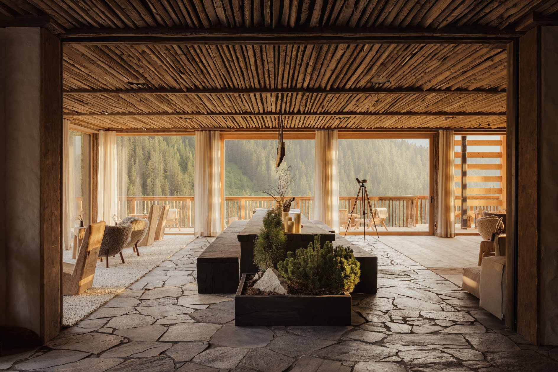 Stone-floored Eriro entrance hall framed by timber slats