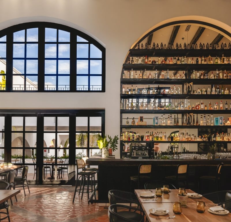 Restaurant and tall bar shelves at Tropicana Los Cabos