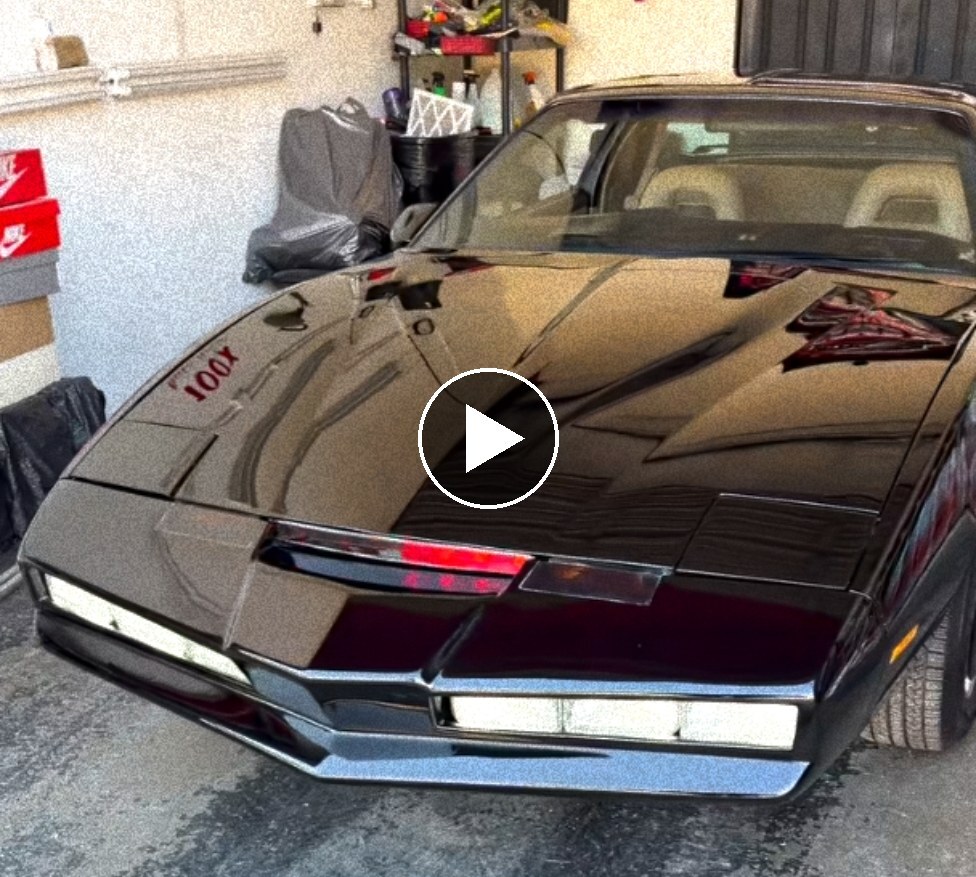 A black Knight Rider KITT replica car parked in a garage (play video)