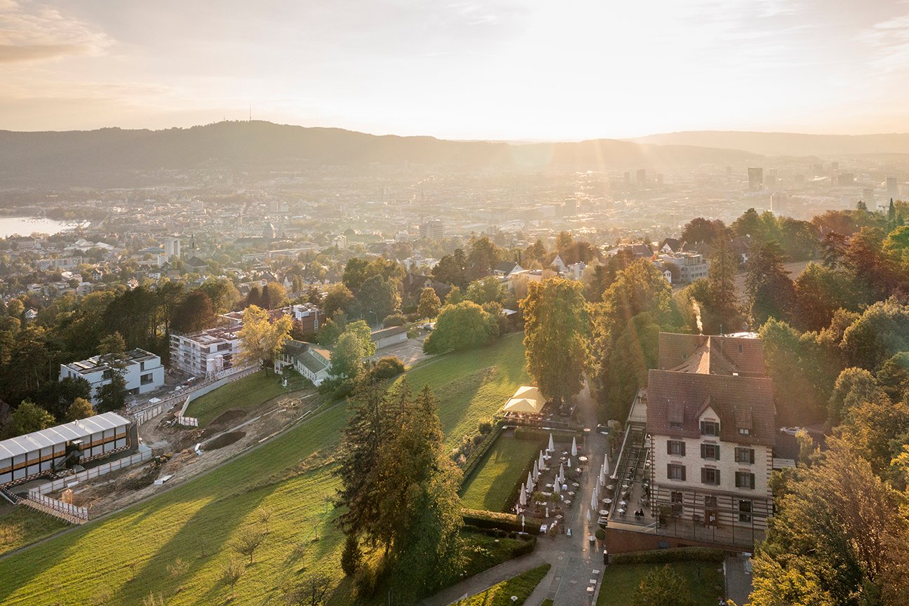 Aerial view of Sorell Hotel Zürichberg above the city