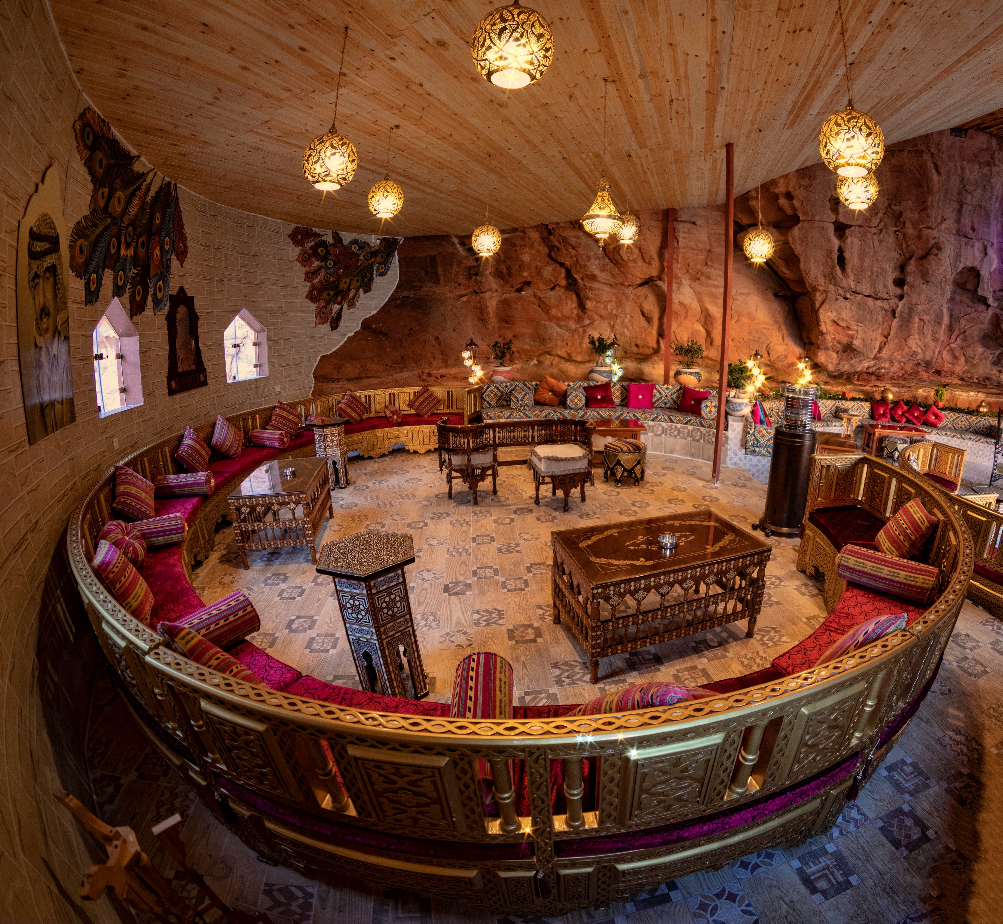 Cave lounge with patterned textiles at Memories Aicha Luxury Camp