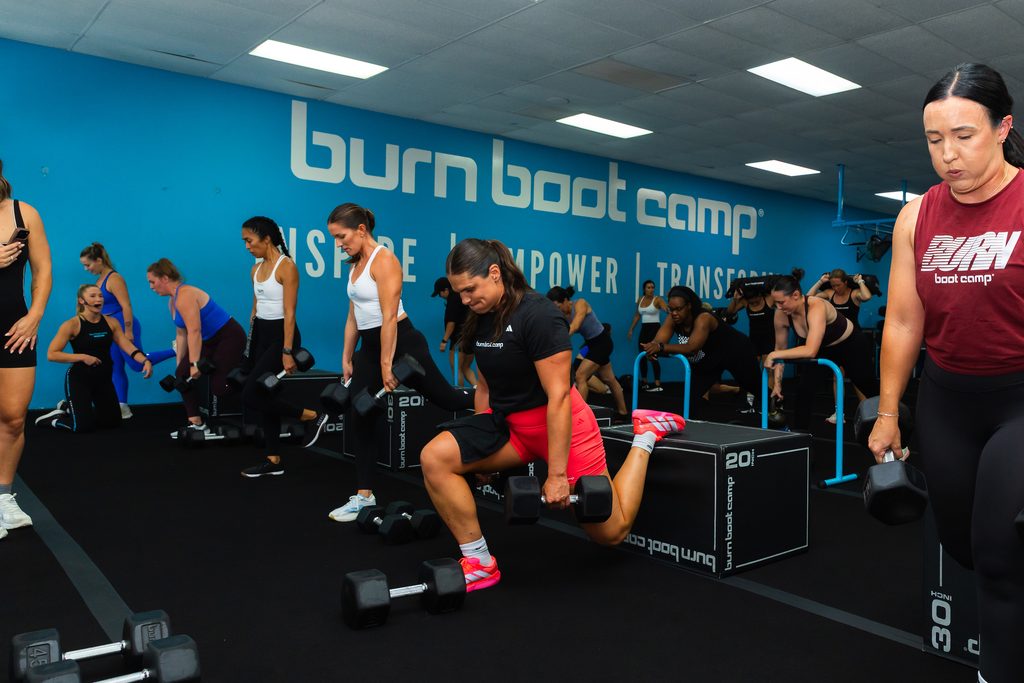Ilona Maher lifts dumbbells alongside Burn Boot Camp members in Poway, California. Courtesy of Burn Boot Camp.