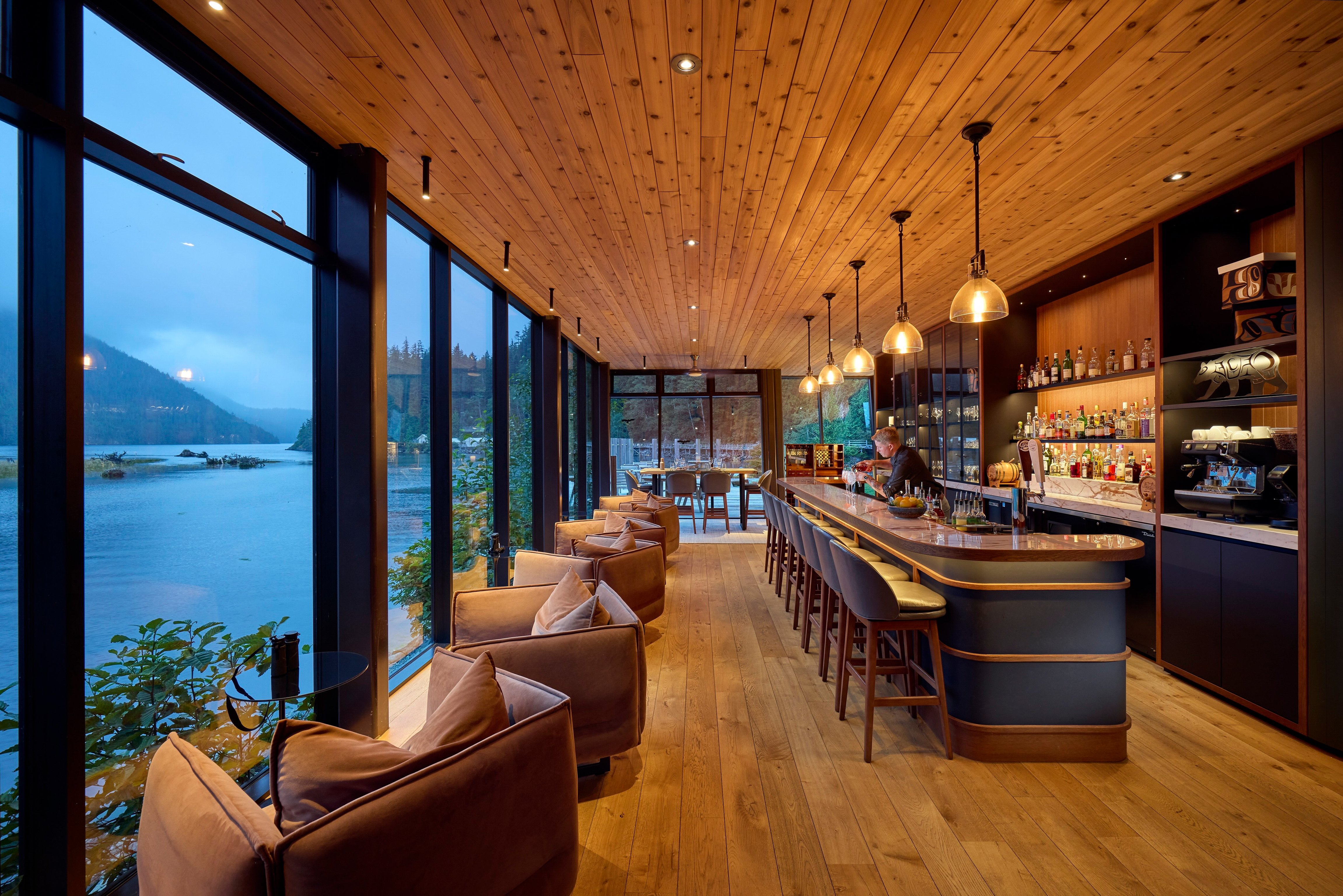 Timber bar with floor-to-ceiling windows overlooking Clayoquot Sound