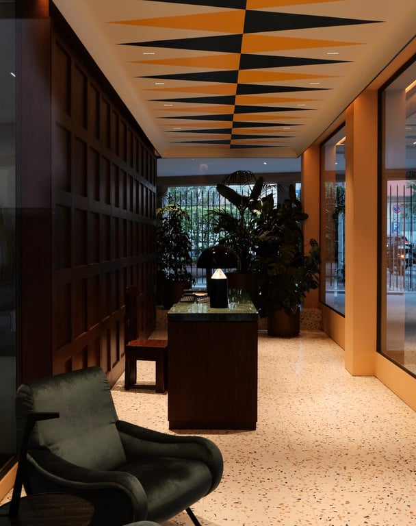 Casa Brivio lobby with geometric ceiling panels and terrazzo flooring